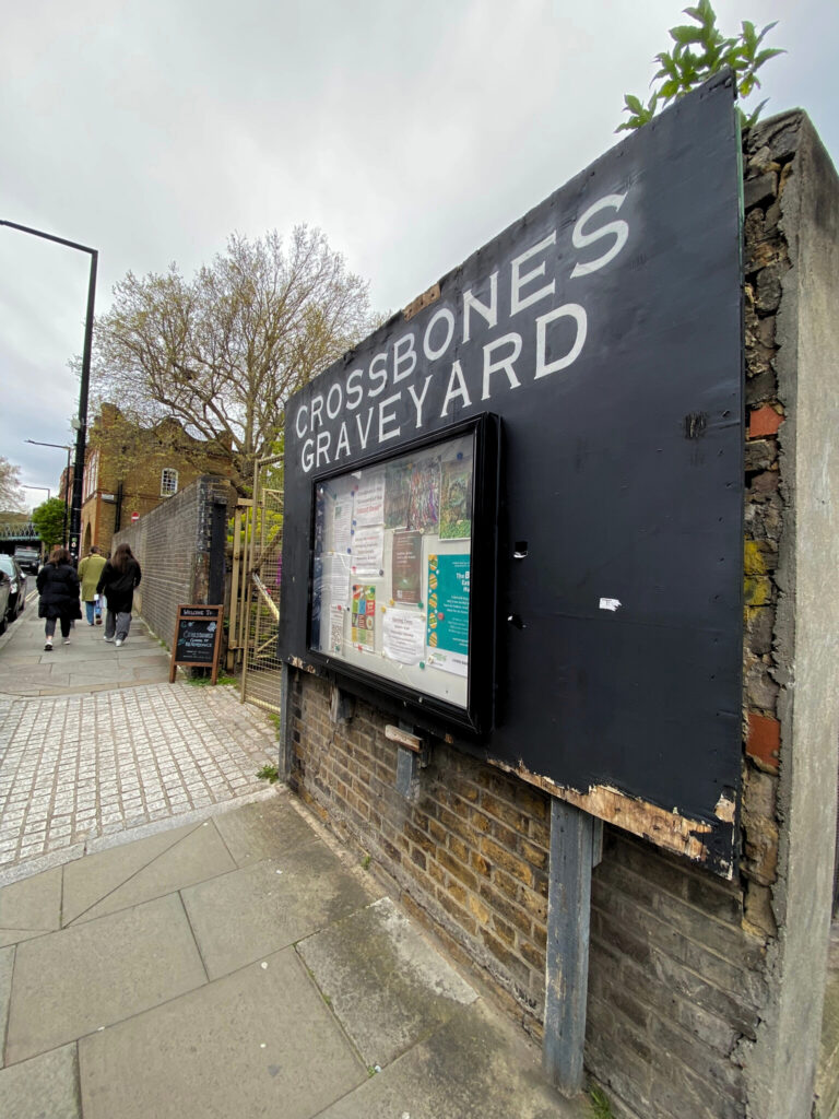 The nondescript sign at the entrance to Crossbones Graveyard