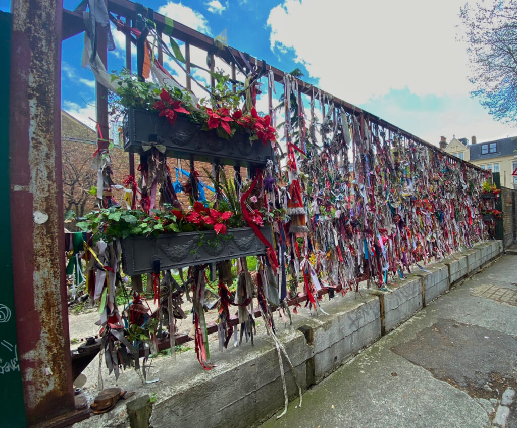 The shrine gate at Crossbones, where people leave mementos