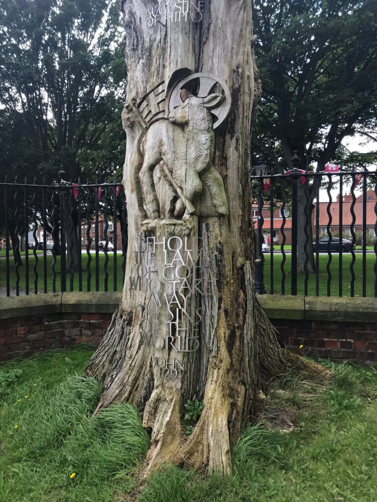 Carved 'Lamb of God' tree in Bridlington churchyard